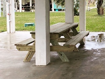 picnic table between pilings