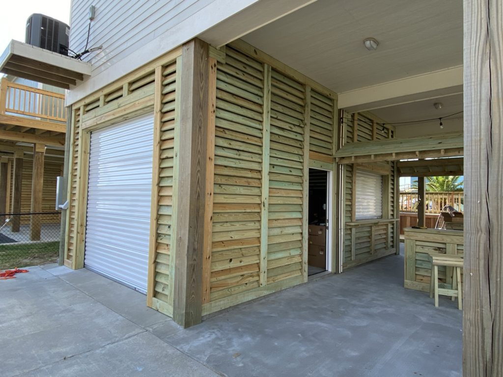 louvered wall garage with rollup garage door