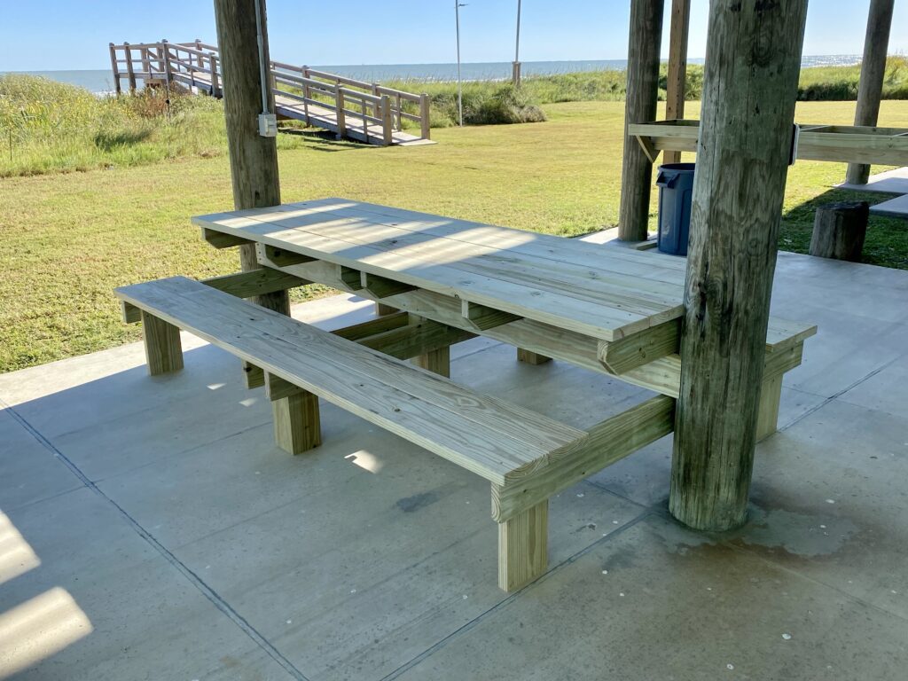modern picnic table between pilings